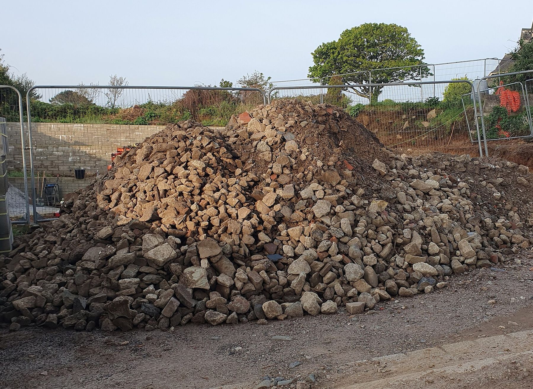 A pile of stone and brick rubble at a demolition site